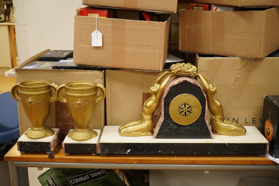 A French Art Deco figural and rouge marble clock garniture, 56cm wide. Condition - poor